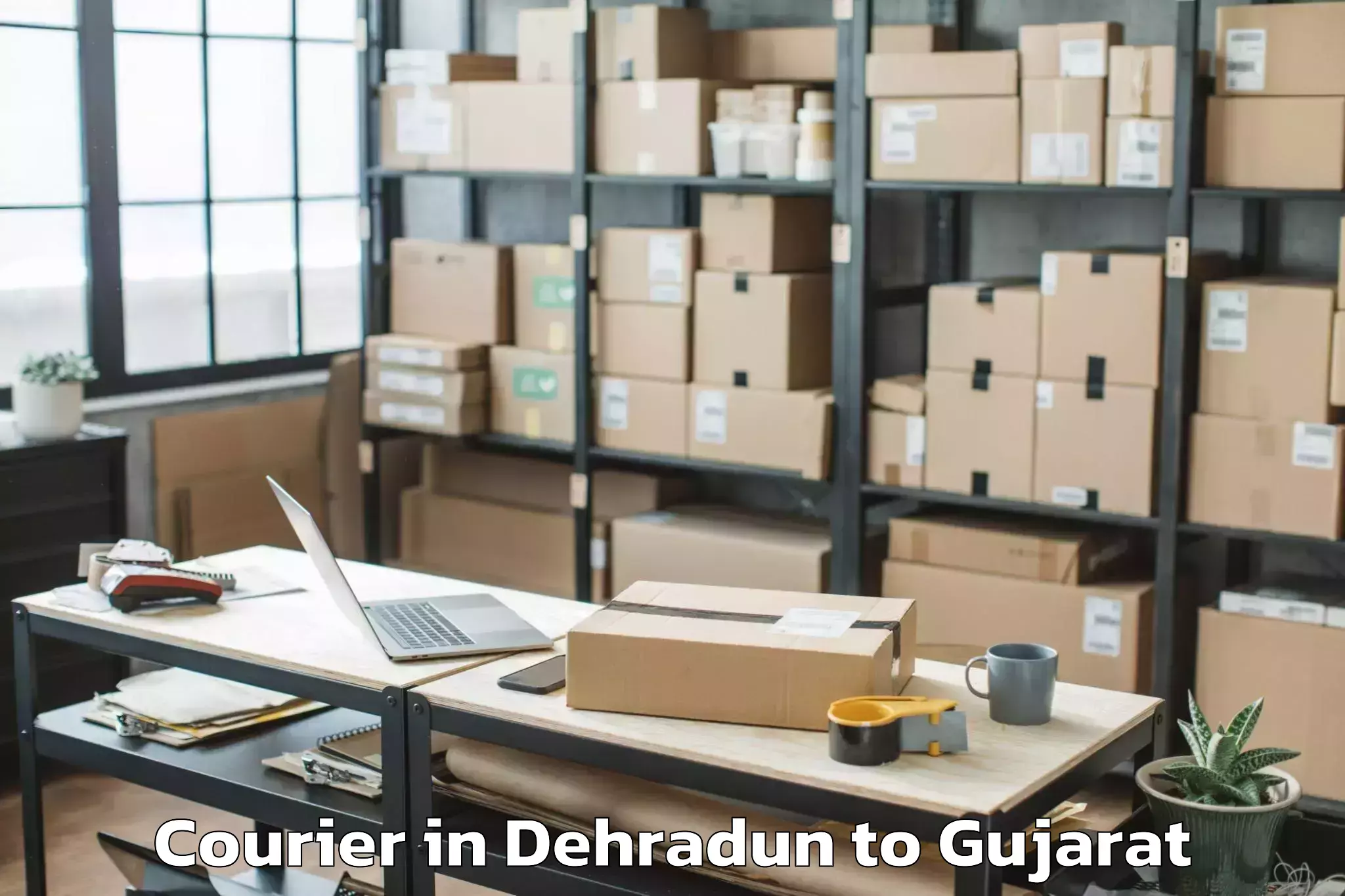 Book Dehradun to Satlasana Courier Online